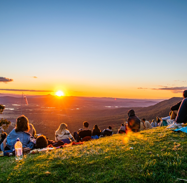 People gathered at sunset on Tambourine Mountain