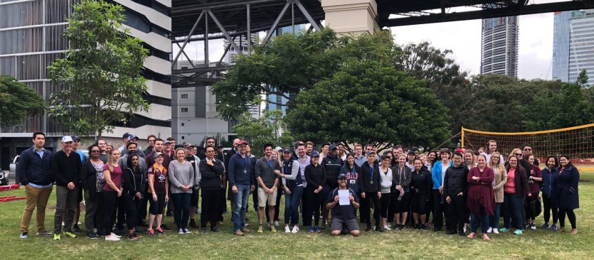 Group photo of QAO staff in a park, following a day of 'Olympic' games