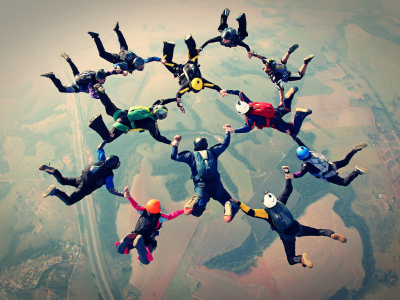 Skydivers holding hands in formation
