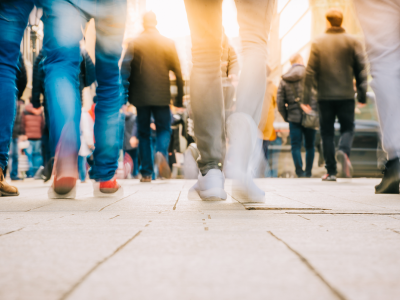 Image of a crowd of people walking down a street