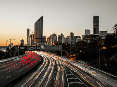 Image showing busy highway traffic headlights driving into Brisbane city at dusk
