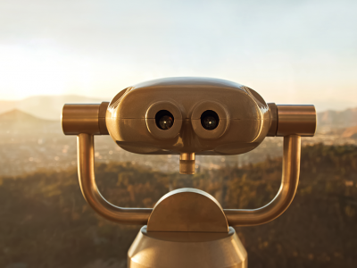 Image of binoculars overlooking a blurred background