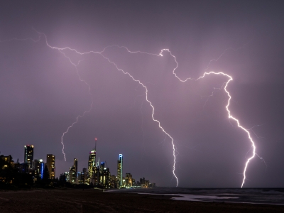 Image of a lightning storm over a Gold Coast beach and buildings