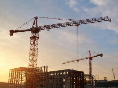 Blog Thumbnail - 2 cranes over construction site