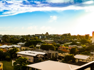 Image from a balcony looking over Brisbane suburb of houses and apartments