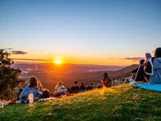 People gathered at sunset on Tambourine Mountain