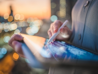 Blog thumbnail: Person using tablet