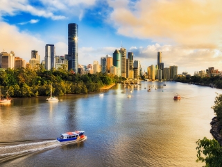 Blog thumbnail: BNE view of CBD from Kangaroo Point, over river with ferry moving through