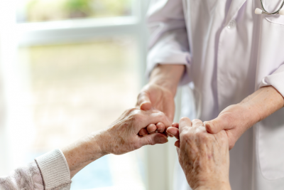 Image of two people standing holding hands