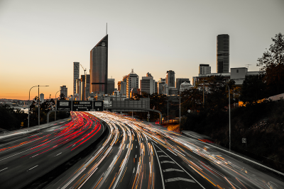 Image showing busy highway traffic headlights driving into Brisbane city at dusk