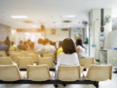 Person sitting in an emergency department waiting room