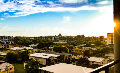 Image from a balcony looking over Brisbane suburb of houses and apartments