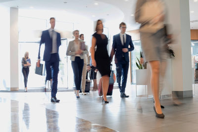 People walking in an office foyer