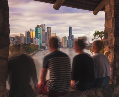 Anonymous teens overlooking Brisbane city
