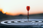 Image of a dart hitting the bullseye on a target
