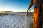 Image of the walkway fence and sand to a Coolangatta beach