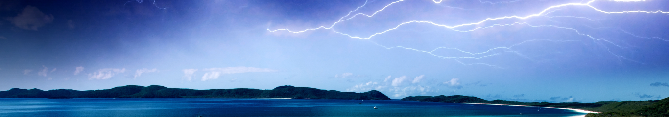 Image of lightning across a beach