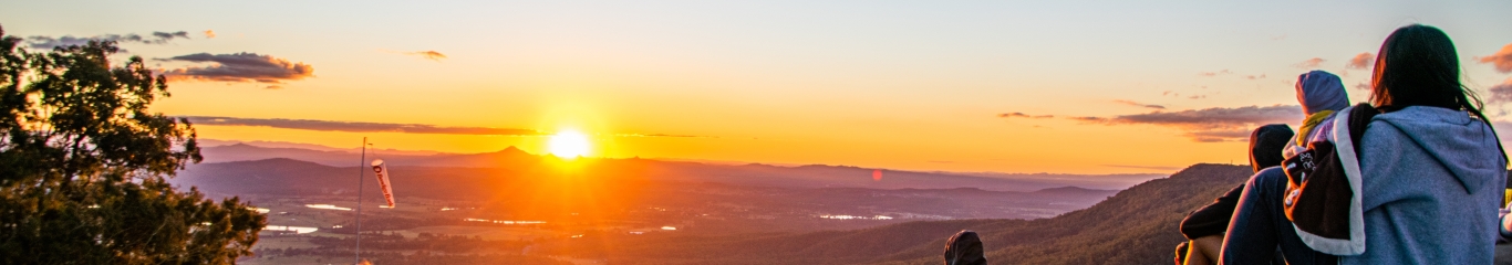 People gathered at sunset on Tambourine Mountain